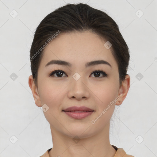 Joyful asian young-adult female with short  brown hair and brown eyes