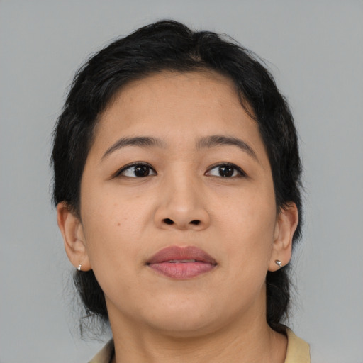 Joyful asian young-adult female with medium  brown hair and brown eyes