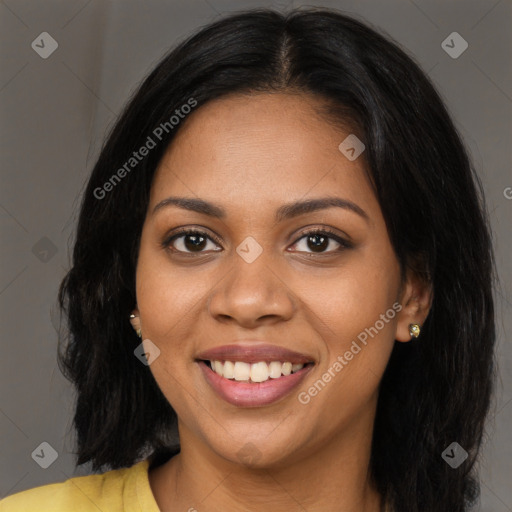 Joyful black young-adult female with long  brown hair and brown eyes