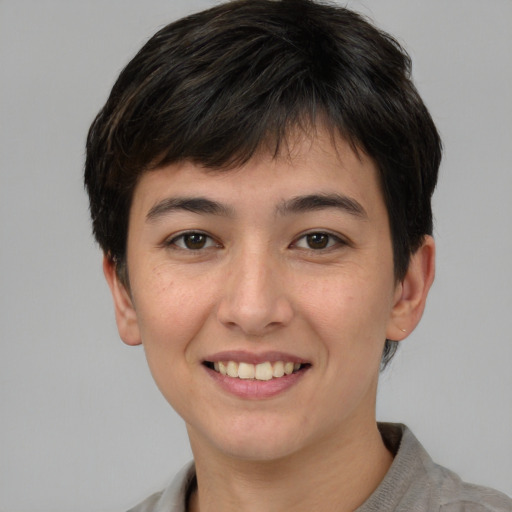 Joyful white young-adult female with short  brown hair and brown eyes