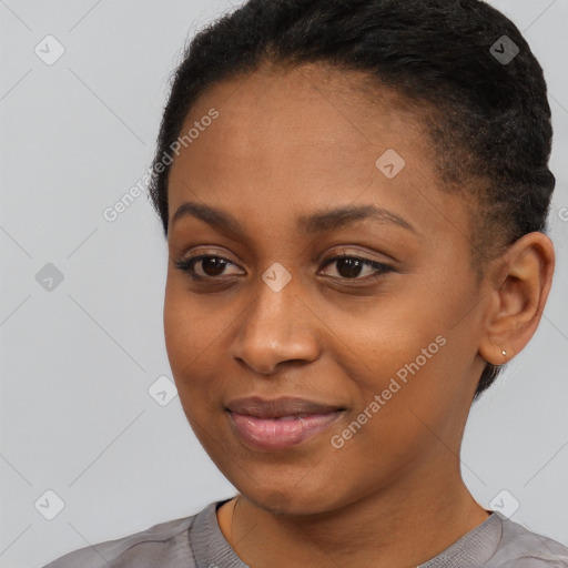 Joyful black young-adult female with short  brown hair and brown eyes