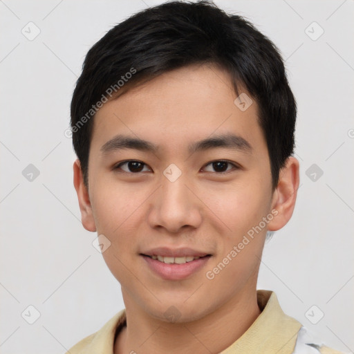 Joyful asian young-adult male with short  brown hair and brown eyes