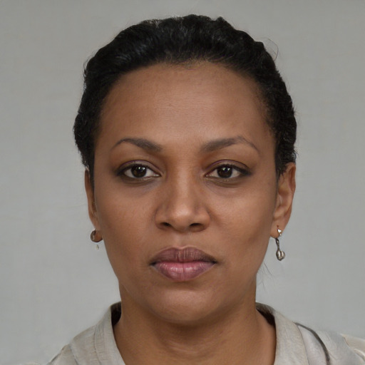 Neutral black young-adult female with short  black hair and brown eyes