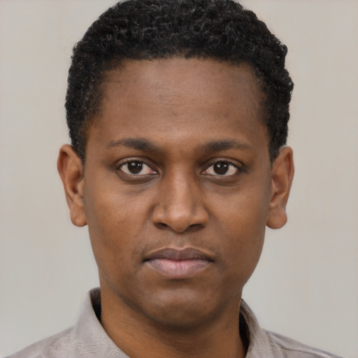 Neutral black young-adult male with short  brown hair and brown eyes