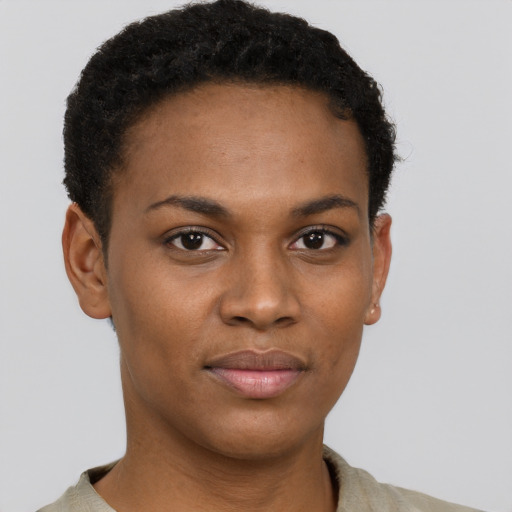 Joyful black young-adult female with short  brown hair and brown eyes