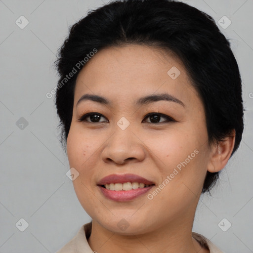 Joyful asian young-adult female with medium  black hair and brown eyes