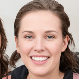 Joyful white young-adult female with medium  brown hair and blue eyes