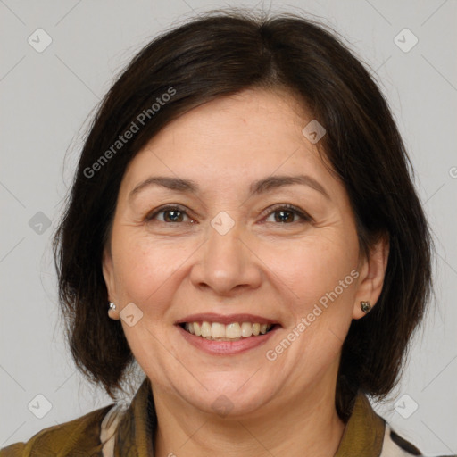 Joyful white adult female with medium  brown hair and brown eyes