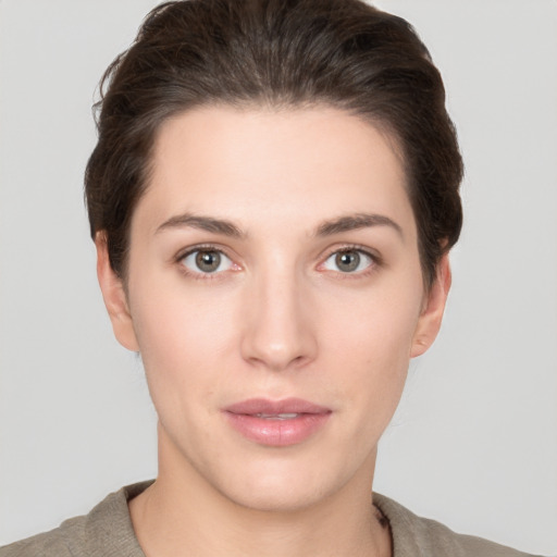 Neutral white young-adult female with short  brown hair and brown eyes