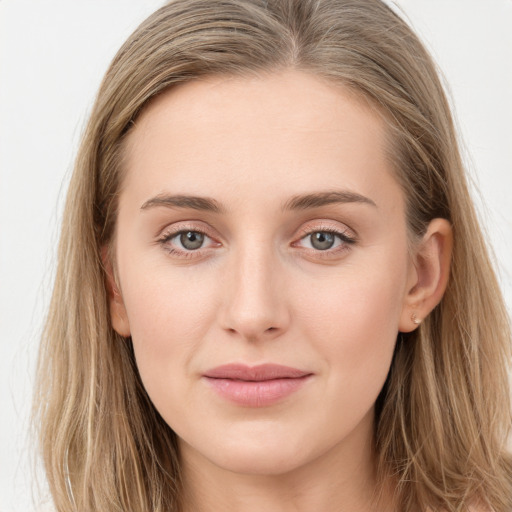 Joyful white young-adult female with long  brown hair and blue eyes