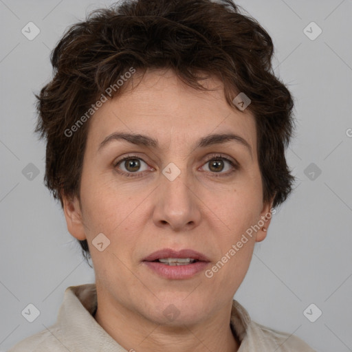 Joyful white adult female with short  brown hair and brown eyes