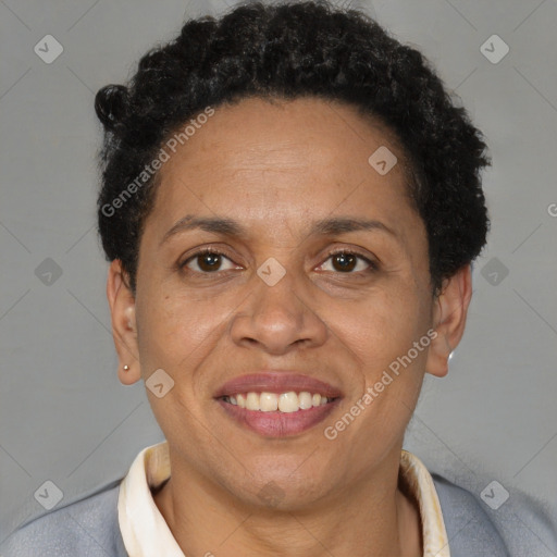 Joyful black adult female with short  brown hair and brown eyes