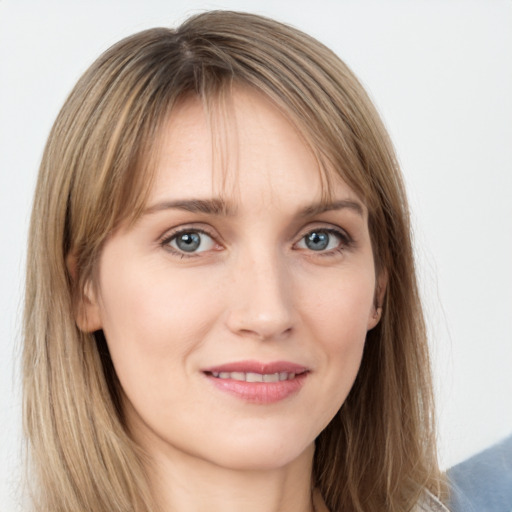 Joyful white young-adult female with long  brown hair and grey eyes