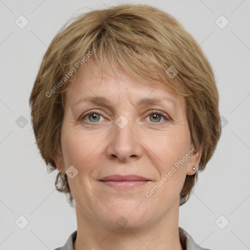 Joyful white adult female with medium  brown hair and grey eyes