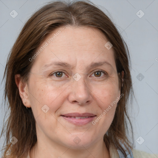 Joyful white adult female with medium  brown hair and brown eyes