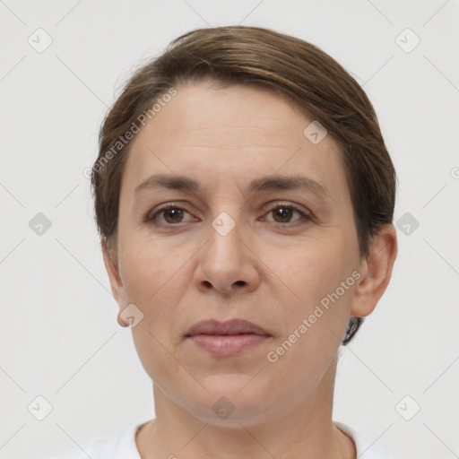 Joyful white adult female with short  brown hair and brown eyes