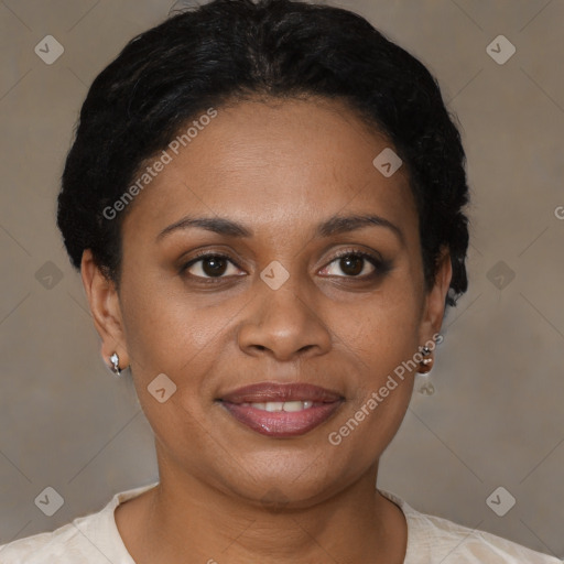 Joyful black young-adult female with short  brown hair and brown eyes