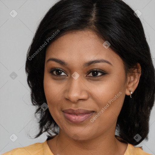 Joyful black young-adult female with medium  brown hair and brown eyes