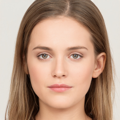 Neutral white young-adult female with long  brown hair and brown eyes