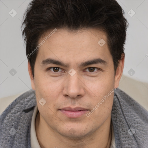 Joyful asian young-adult male with short  brown hair and brown eyes