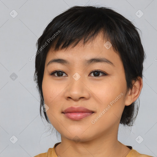 Joyful asian young-adult female with medium  black hair and brown eyes