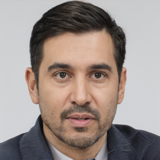 Neutral white adult male with short  black hair and brown eyes