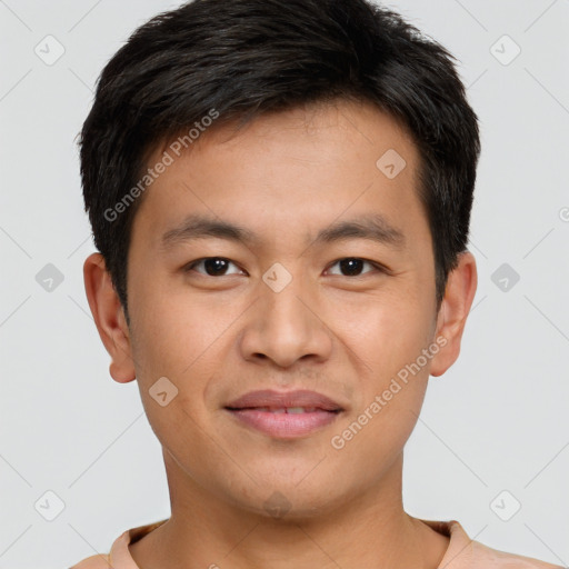 Joyful asian young-adult male with short  brown hair and brown eyes