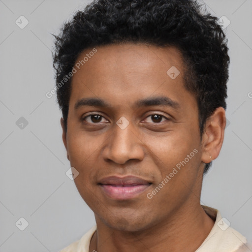 Joyful black young-adult male with short  black hair and brown eyes