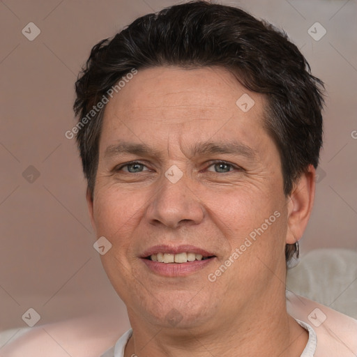 Joyful white adult male with short  brown hair and brown eyes