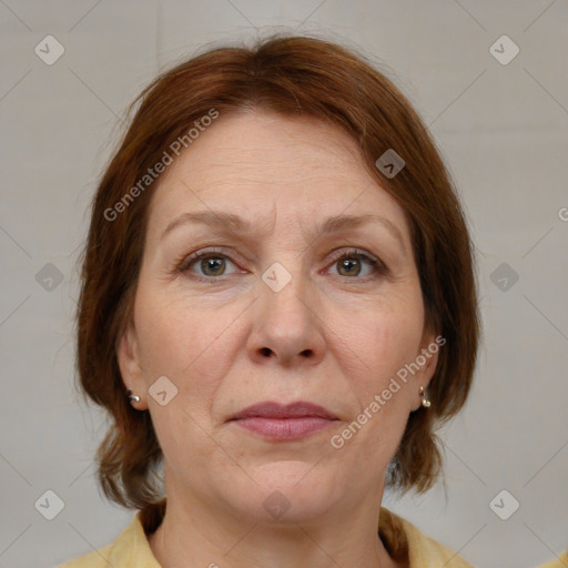 Joyful white adult female with medium  brown hair and grey eyes