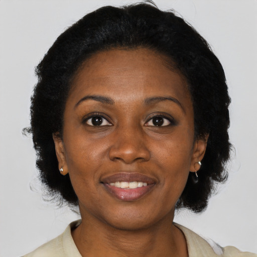 Joyful latino young-adult female with short  black hair and brown eyes