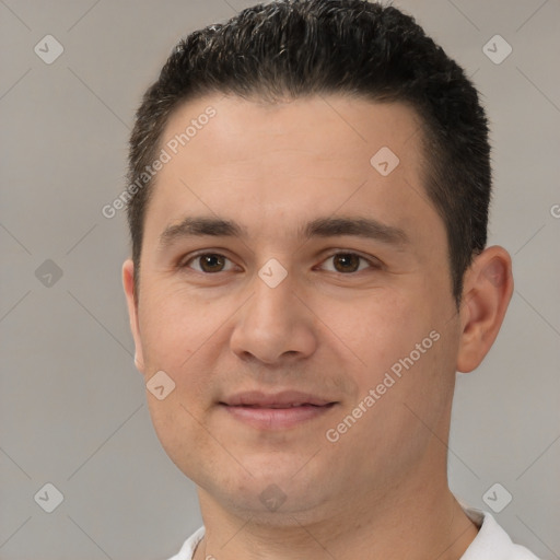 Joyful white young-adult male with short  brown hair and brown eyes