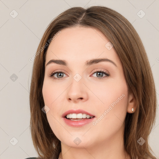 Neutral white young-adult female with long  brown hair and green eyes