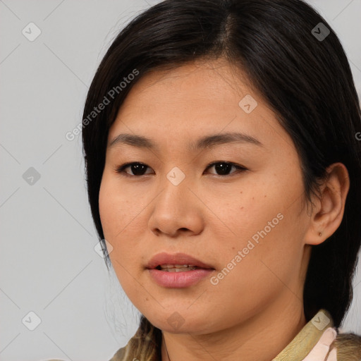 Joyful asian young-adult female with medium  brown hair and brown eyes