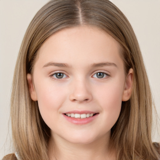 Joyful white child female with long  brown hair and brown eyes