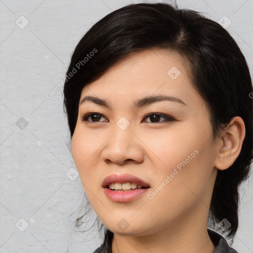 Joyful asian young-adult female with medium  black hair and brown eyes