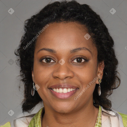 Joyful black young-adult female with medium  brown hair and brown eyes