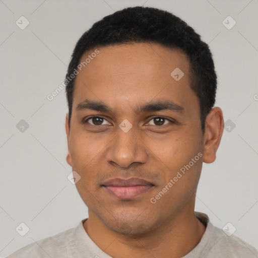 Joyful latino young-adult male with short  black hair and brown eyes