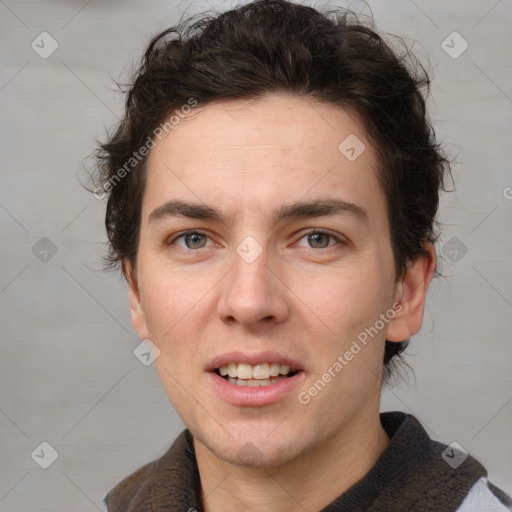 Joyful white adult male with short  brown hair and grey eyes