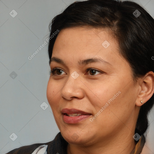 Joyful white adult female with medium  brown hair and brown eyes