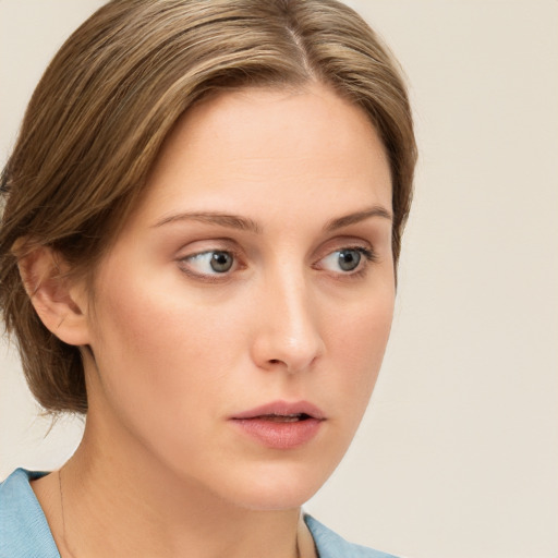 Neutral white young-adult female with medium  brown hair and green eyes