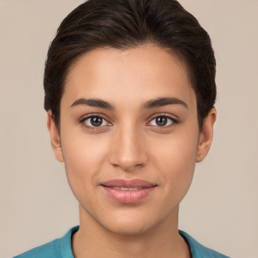 Joyful white young-adult female with short  brown hair and brown eyes