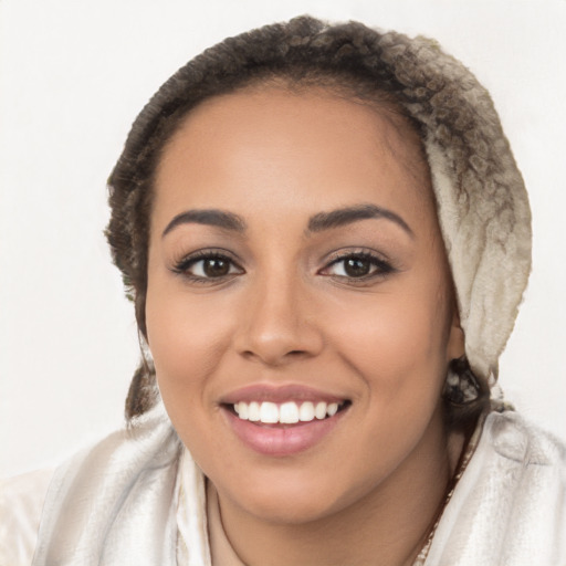 Joyful latino young-adult female with long  brown hair and brown eyes