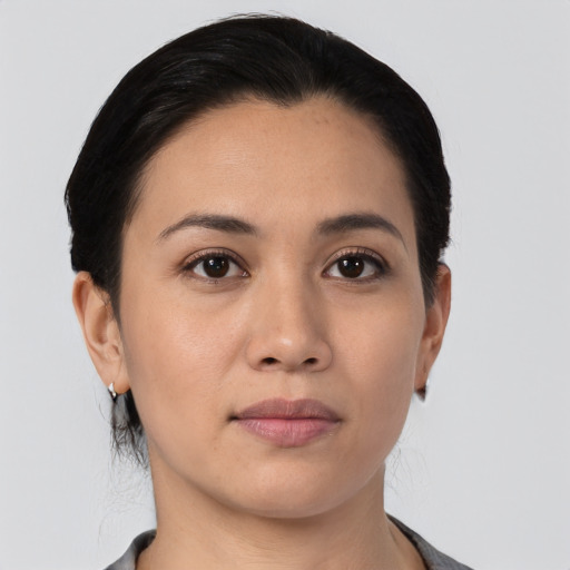 Joyful asian young-adult female with medium  black hair and brown eyes