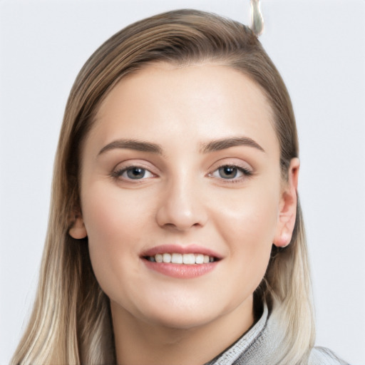 Joyful white young-adult female with long  brown hair and grey eyes