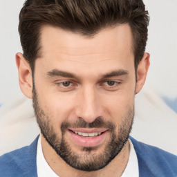 Joyful white young-adult male with short  brown hair and brown eyes