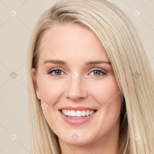 Joyful white young-adult female with long  brown hair and blue eyes