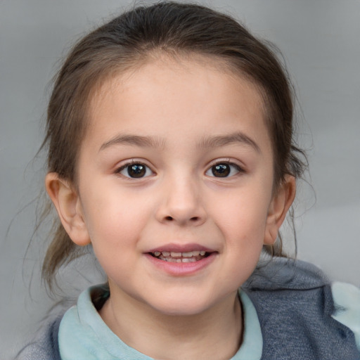 Joyful white child female with medium  brown hair and brown eyes