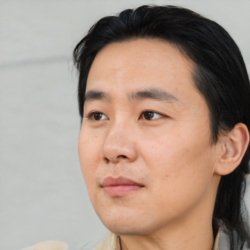 Neutral asian young-adult male with medium  black hair and brown eyes