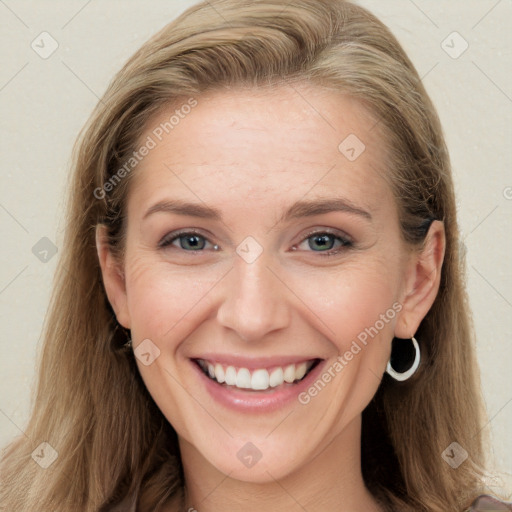 Joyful white young-adult female with long  brown hair and grey eyes